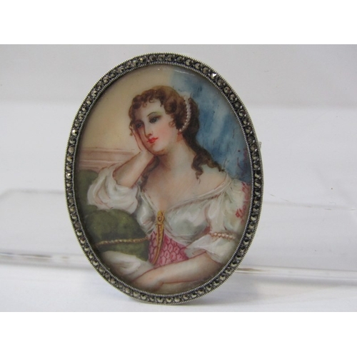 114 - PORTRAIT BROOCH, a ceramic oval portrait brooch, decorated with a figure of a lady in a circular sil... 