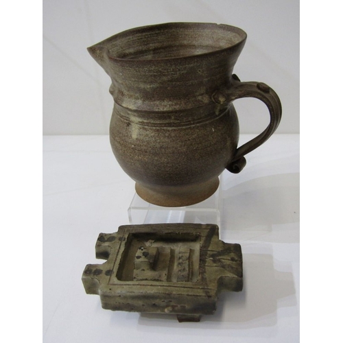 91 - STUDIO POTTERY, a studio pottery jug with light and medium brown glaze, twist handle (chip), 15cm he... 