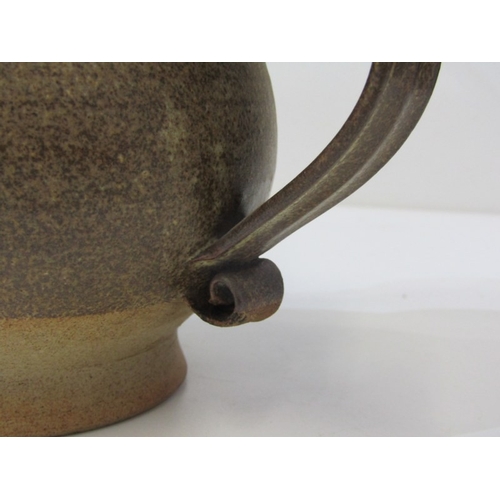 91 - STUDIO POTTERY, a studio pottery jug with light and medium brown glaze, twist handle (chip), 15cm he... 
