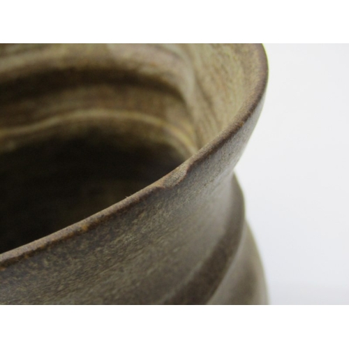 91 - STUDIO POTTERY, a studio pottery jug with light and medium brown glaze, twist handle (chip), 15cm he... 