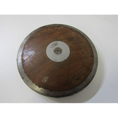 92 - VINTAGE DISCUS,  a vintage metal on wood 1.25 kilo discus, 18.5cm wide also a WWII Far East theatre ... 