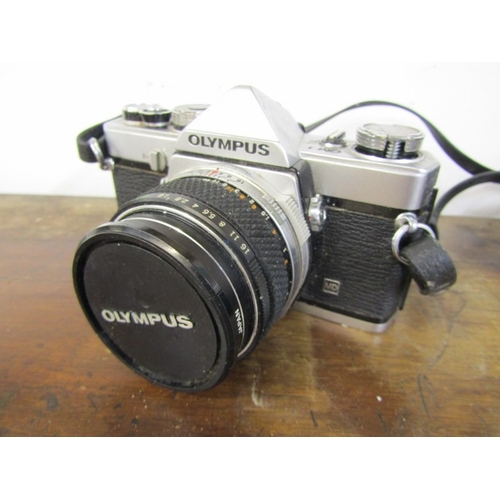 58 - PHOTOGRAPHY - OLYMPUS OM-1 CAMERA, a vintage Olympus OM-1 film camera with a 35mm single lens reflex... 