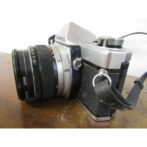 58 - PHOTOGRAPHY - OLYMPUS OM-1 CAMERA, a vintage Olympus OM-1 film camera with a 35mm single lens reflex... 