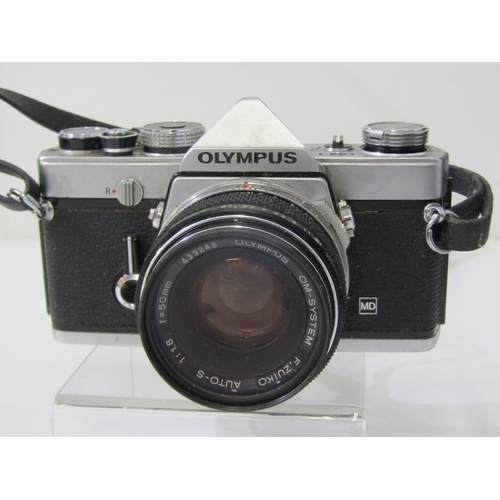 58 - PHOTOGRAPHY - OLYMPUS OM-1 CAMERA, a vintage Olympus OM-1 film camera with a 35mm single lens reflex... 