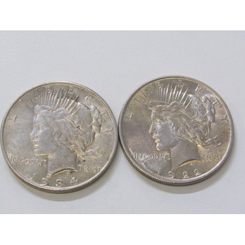 19 - 1922/1934 USA Silver ‘Peace Dollars both good examples in higher grade. 26.2 grams each