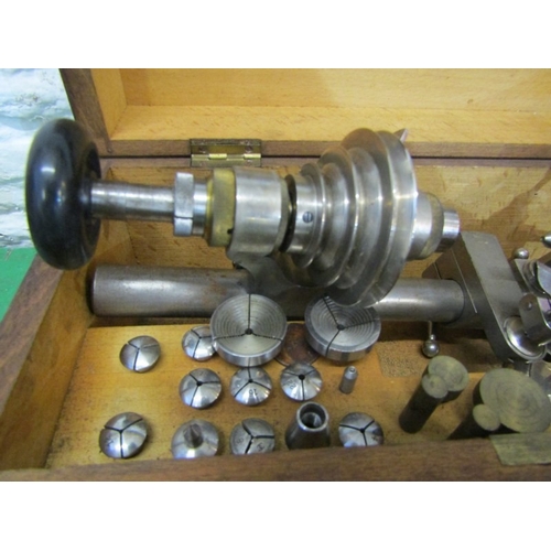 WATCHMAKERS LATHE, a cased watchmakers lathe including various collets ...