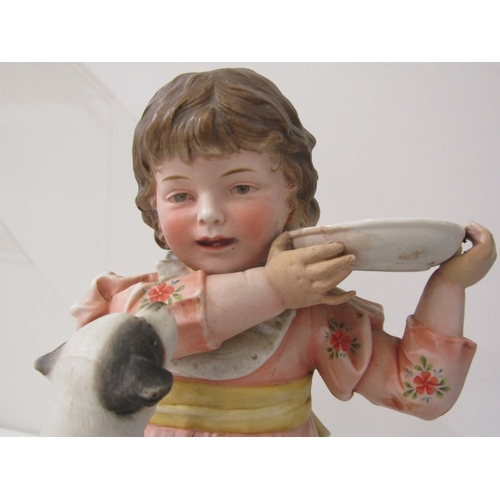 13 - BISQUE PORCELAIN FIGURE, a late 19th Century German bisque porcelain figurine of a girl with dog (re... 