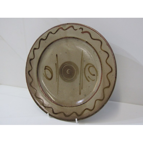 27 - WENFORD BRIDGE POTTERY PLATES,  2 earthenware plates, both with incised and sgraffito scrolling deco... 