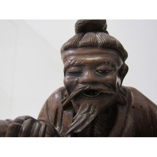 1 - ORIENTAL CARVING, a Chinese carved wood sculpture depicting a seated bearded man with a young boy on... 