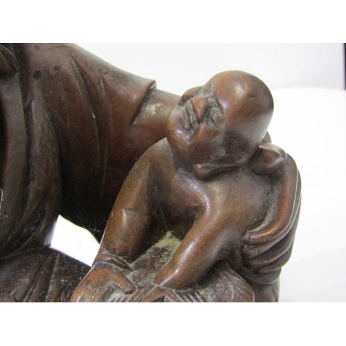 1 - ORIENTAL CARVING, a Chinese carved wood sculpture depicting a seated bearded man with a young boy on... 