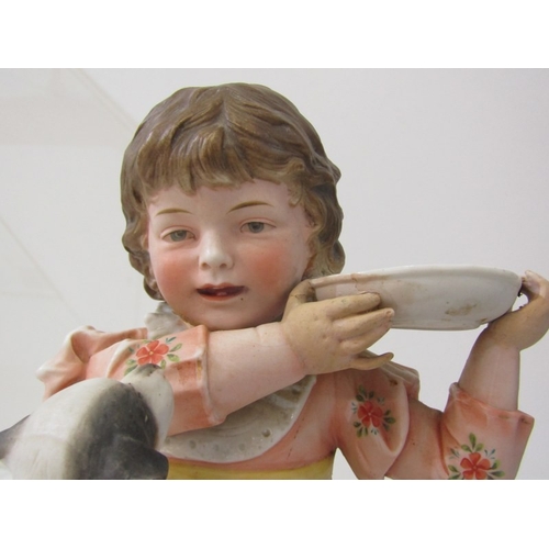 13 - BISQUE PORCELAIN FIGURE, a late 19th Century German bisque porcelain figurine of a girl with dog (re... 