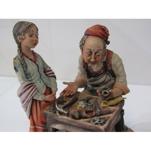 15 - CAPO DI MONTE, a Capo di Monte figurine depicting a cobbler and child, signed 'Rori' c.1974. 24.5cm ... 