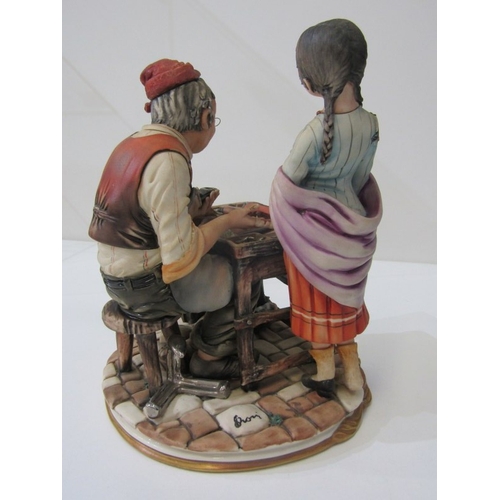 15 - CAPO DI MONTE, a Capo di Monte figurine depicting a cobbler and child, signed 'Rori' c.1974. 24.5cm ... 