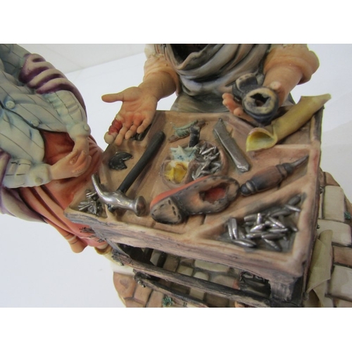 15 - CAPO DI MONTE, a Capo di Monte figurine depicting a cobbler and child, signed 'Rori' c.1974. 24.5cm ... 