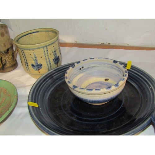 19 - STUDIO POTTERY, 12 pieces of various studio pottery, some bearing initials 'C.B.', including bowls, ... 