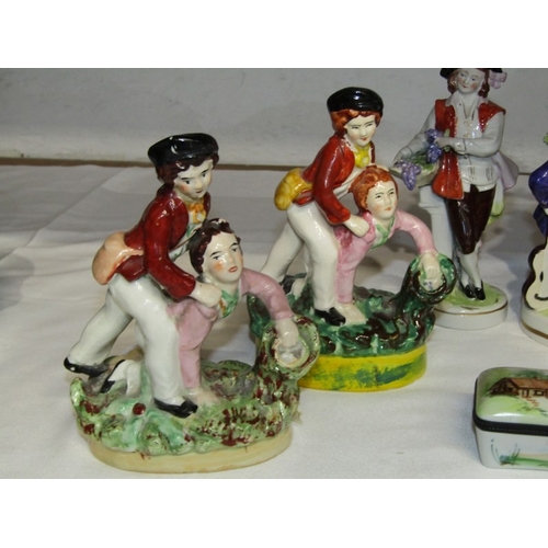 21 - CERAMICS, a 19th century Staffordshire figure depicting boys collecting birds eggs, a similar reprod... 