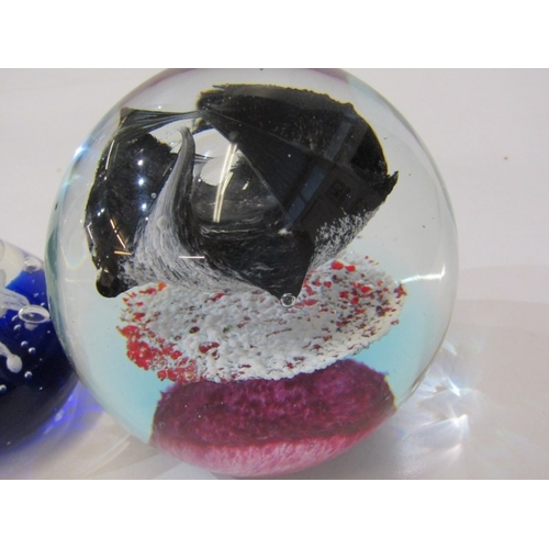 23 - GLASS PAPERWEIGHTS, 3 various glass paperweights, together with a stone ball on stand, another stone... 