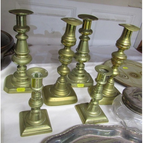 26 - ANTIQUE METALWARE, 3 pairs of antique brass candlesticks, 23cm height, 22.5cm height and 14cm height... 