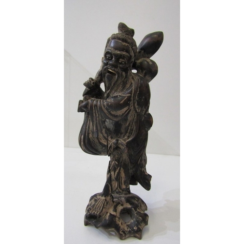42 - ORIENTAL CARVINGS, a vintage Chinese carved wooden statue depicting a sage, such as Shou Xing, in th... 