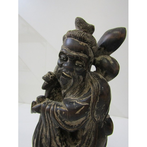 42 - ORIENTAL CARVINGS, a vintage Chinese carved wooden statue depicting a sage, such as Shou Xing, in th... 