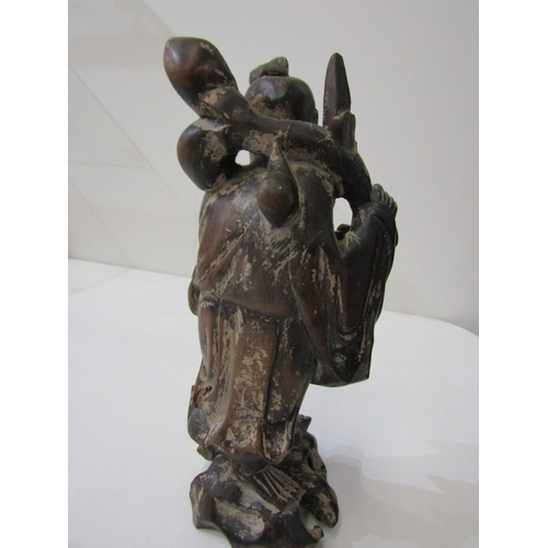 42 - ORIENTAL CARVINGS, a vintage Chinese carved wooden statue depicting a sage, such as Shou Xing, in th... 