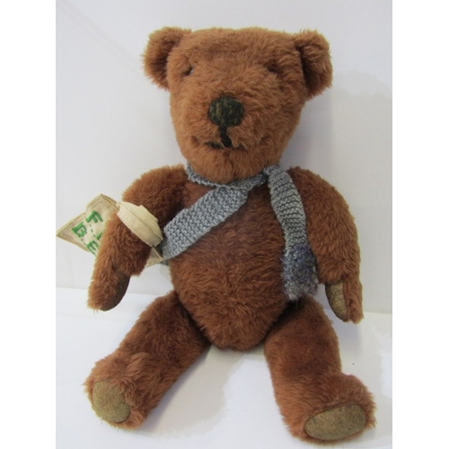 43 - TEDDY BEARS, a teddy bear with cinnamon brown body, stitched black nose and mouth with growler, carr... 