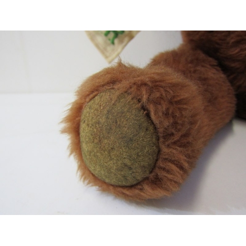 43 - TEDDY BEARS, a teddy bear with cinnamon brown body, stitched black nose and mouth with growler, carr... 