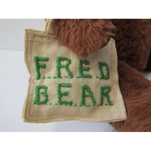 43 - TEDDY BEARS, a teddy bear with cinnamon brown body, stitched black nose and mouth with growler, carr... 