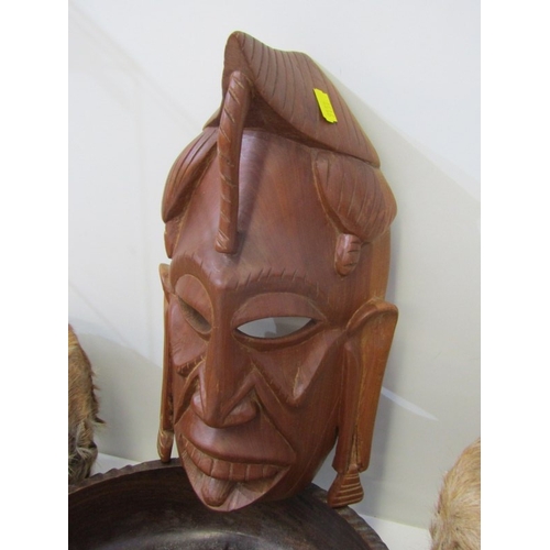 53 - ETHNIC CARVINGS, collection of carved wood animals including rhinos and elephants, ethnic masks and ... 