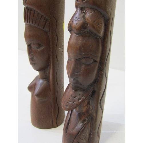 53 - ETHNIC CARVINGS, collection of carved wood animals including rhinos and elephants, ethnic masks and ... 