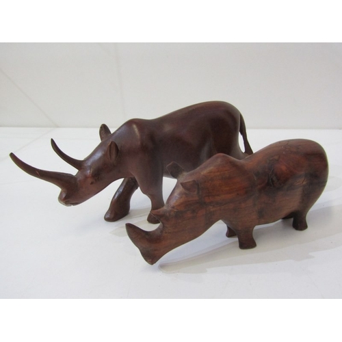 53 - ETHNIC CARVINGS, collection of carved wood animals including rhinos and elephants, ethnic masks and ... 
