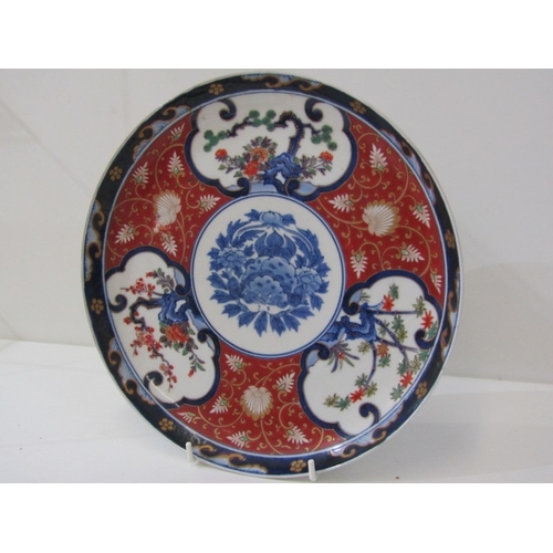 57 - ORIENTAL CERAMICS, a pair of floral decorated Imari pattern plates, both bearing 6 character reign m... 
