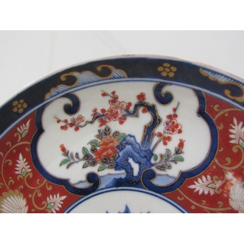 57 - ORIENTAL CERAMICS, a pair of floral decorated Imari pattern plates, both bearing 6 character reign m... 
