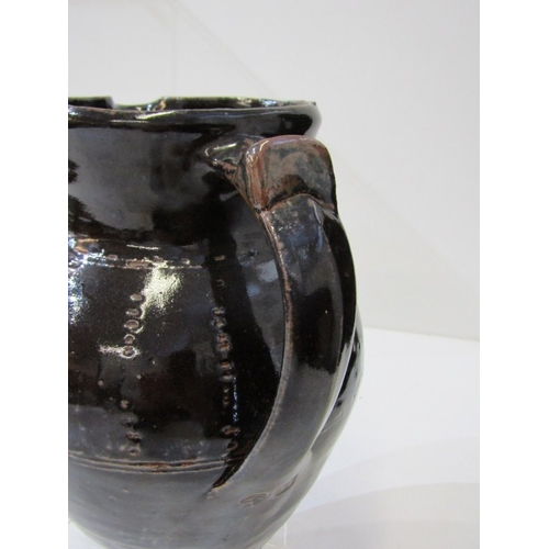 59 - WENFORD BRIDGE POTTERY, a Wenford Bridge pottery jug, the dark brown glaze with impressed dotted lin... 