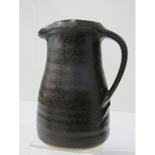 8 - LEACH POTTERY, a Leach Pottery handled jug with pouring lip and overall dark brown glaze, Leach Pott... 