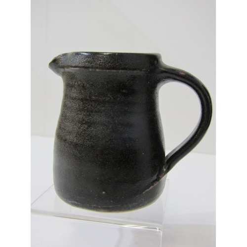 8 - LEACH POTTERY, a Leach Pottery handled jug with pouring lip and overall dark brown glaze, Leach Pott... 