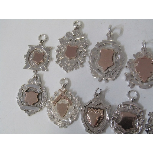 22 - SILVER FOB MEDALLIONS, collection of 12 silver fob medallions, 8 with gold inlaid centres, various d... 