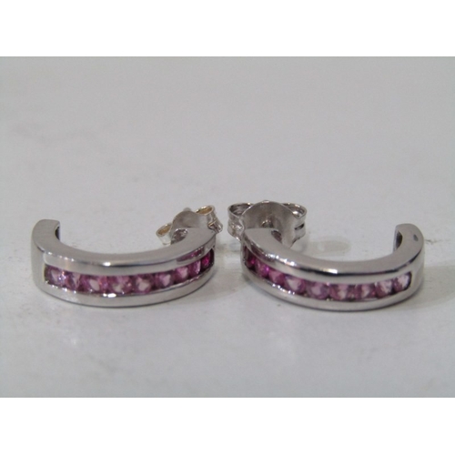 28 - WHITE GOLD & PINK SAPPHIRE EARRINGS, pair of 9ct white gold earrings with channel set pink sapphires... 