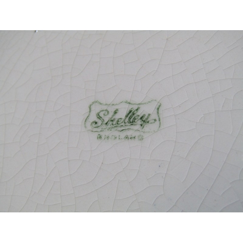 321 - SHELLEY POTTERY, a large Shelley Art Deco shallow dish, central brown and cream ground surrounded by... 