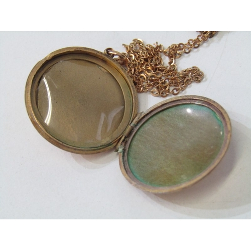 35 - GOLD LOCKET ON CHAIN, circular gold locket (tests as 18ct) set a round brilliant cut diamond, 2.5cm ... 