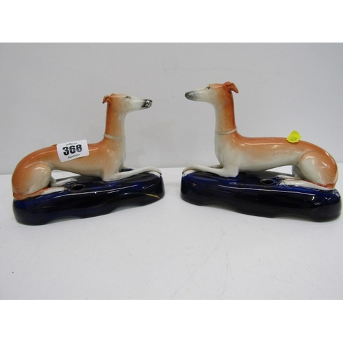 368 - STAFFORDSHIRE GREYHOUND INKWELLS, a pair of 19th century Staffordshire pottery greyhound inkwells, b... 