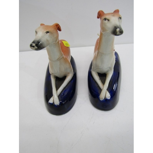 368 - STAFFORDSHIRE GREYHOUND INKWELLS, a pair of 19th century Staffordshire pottery greyhound inkwells, b... 