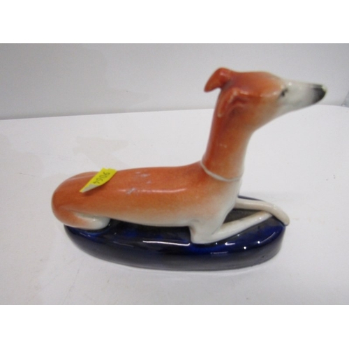 368 - STAFFORDSHIRE GREYHOUND INKWELLS, a pair of 19th century Staffordshire pottery greyhound inkwells, b... 