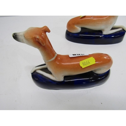 368 - STAFFORDSHIRE GREYHOUND INKWELLS, a pair of 19th century Staffordshire pottery greyhound inkwells, b... 