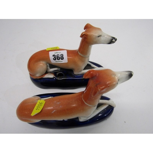 368 - STAFFORDSHIRE GREYHOUND INKWELLS, a pair of 19th century Staffordshire pottery greyhound inkwells, b... 