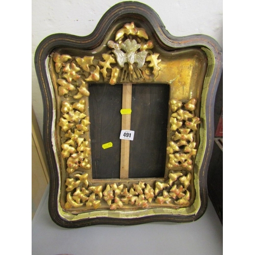 491 - ANTIQUE FRAME, an ornate gilt wood frame of Rococo design with floral borders and top bird motif (da... 