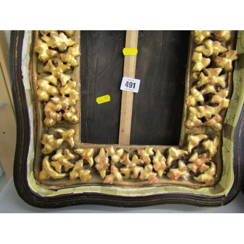 491 - ANTIQUE FRAME, an ornate gilt wood frame of Rococo design with floral borders and top bird motif (da... 
