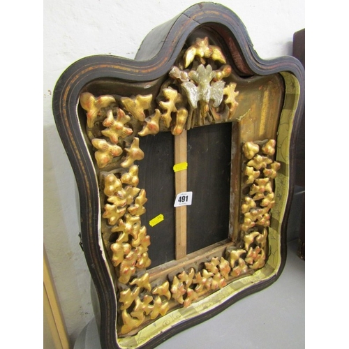 491 - ANTIQUE FRAME, an ornate gilt wood frame of Rococo design with floral borders and top bird motif (da... 