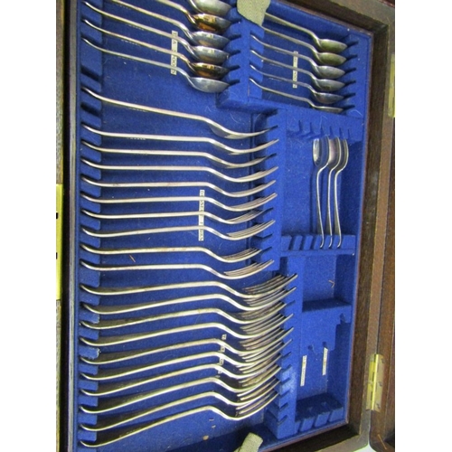 494 - CANTEEN OF CUTLERY, an oak canteen cutlery box with 2 carry handles by Wales & McCulloch with blue l... 