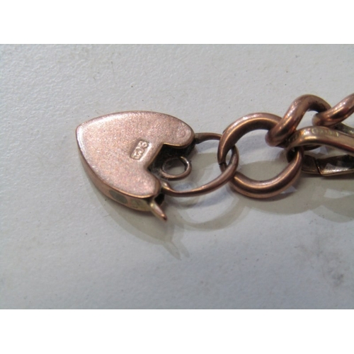 56 - HEAVY GOLD CURB LINK BRACELET, 9ct rose gold curb link watch chain bracelet with padlock clasp, 24.2... 